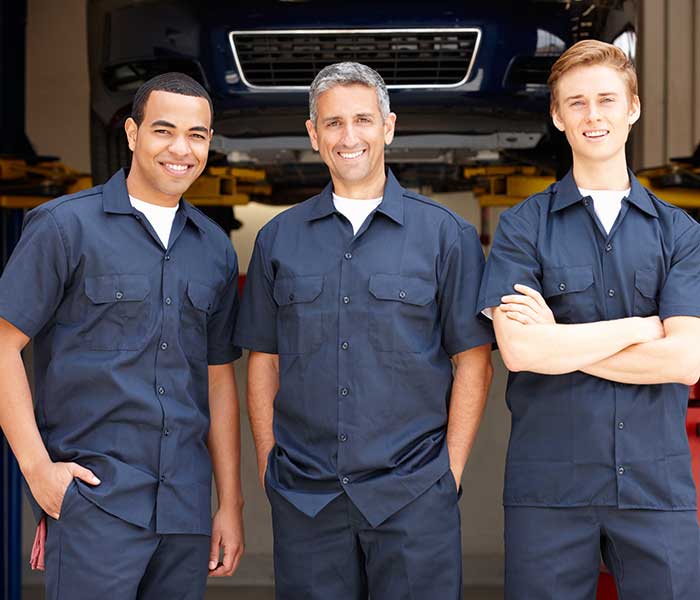 Three men in uniforms at work