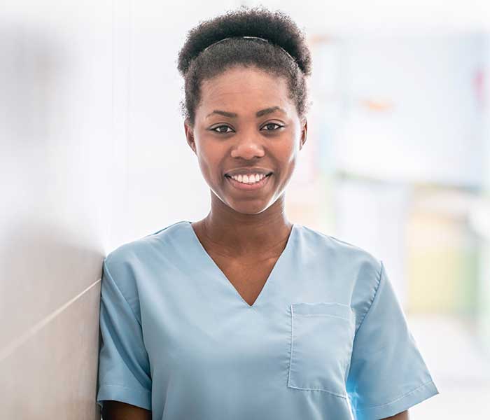 A portrait of a nurse smiling